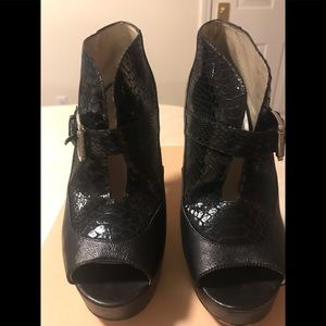 Misses slightly worn booties with a few knicks